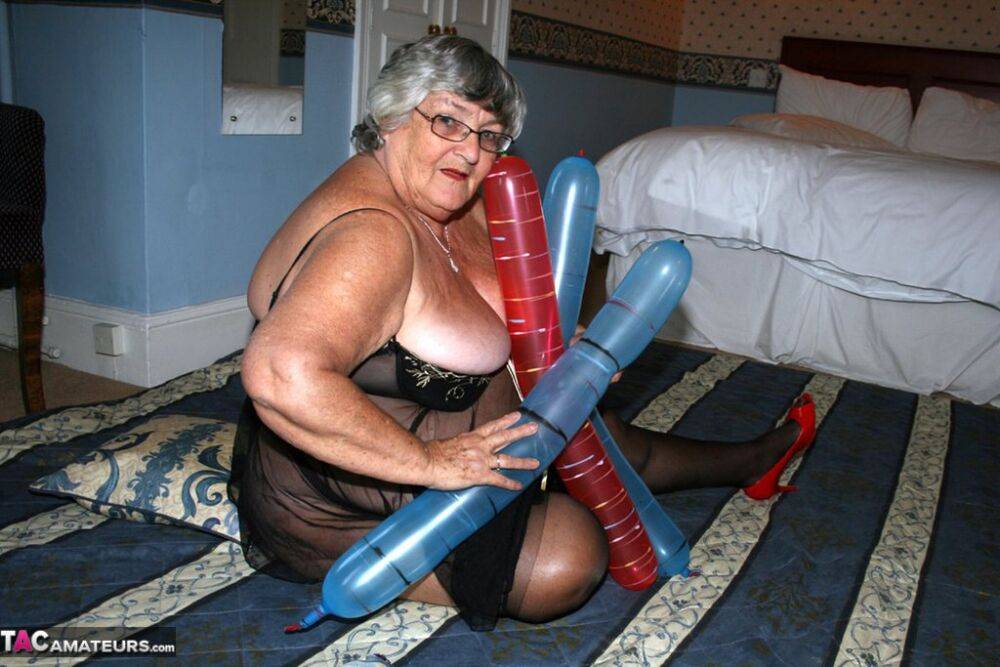 Overweight British woman Grandma Libby plays with balloon dildos in lingerie - #4