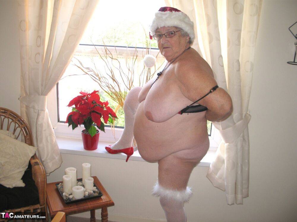 British nan Grandma Libby exposes her fat body in a Christmas hat and hosiery - #13