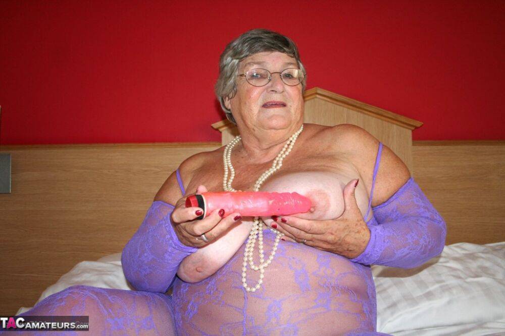 British fatty Grandma Libby masturbates on a bed in a crotchless bodystocking - #6
