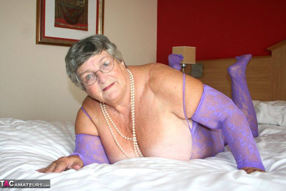British fatty Grandma Libby masturbates on a bed in a crotchless bodystocking - #14