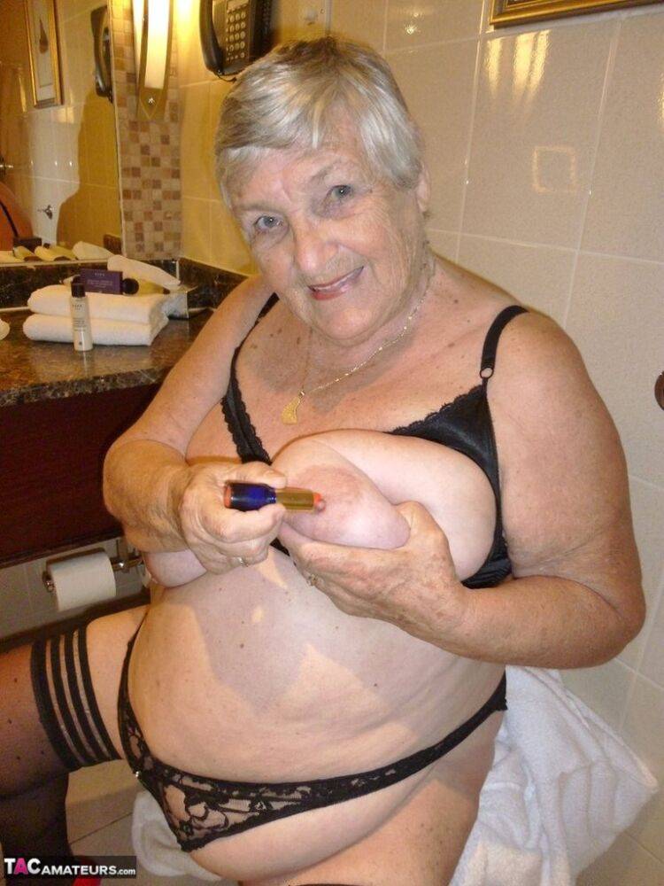Fat nan Grandma Libby removes a bathrobe to pose nude in a cupless bra - #8