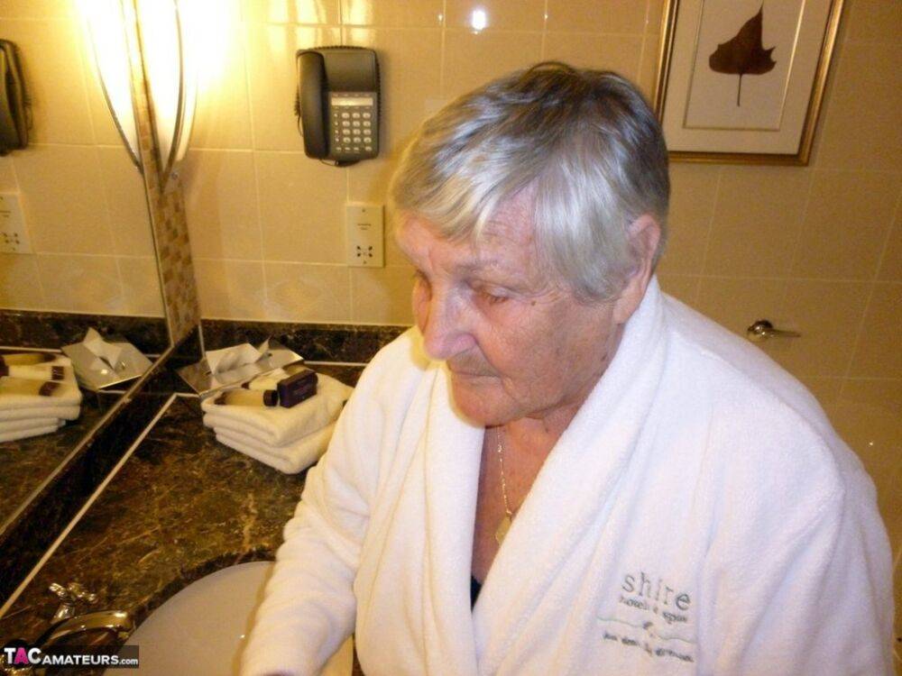 Fat nan Grandma Libby removes a bathrobe to pose nude in a cupless bra - #3