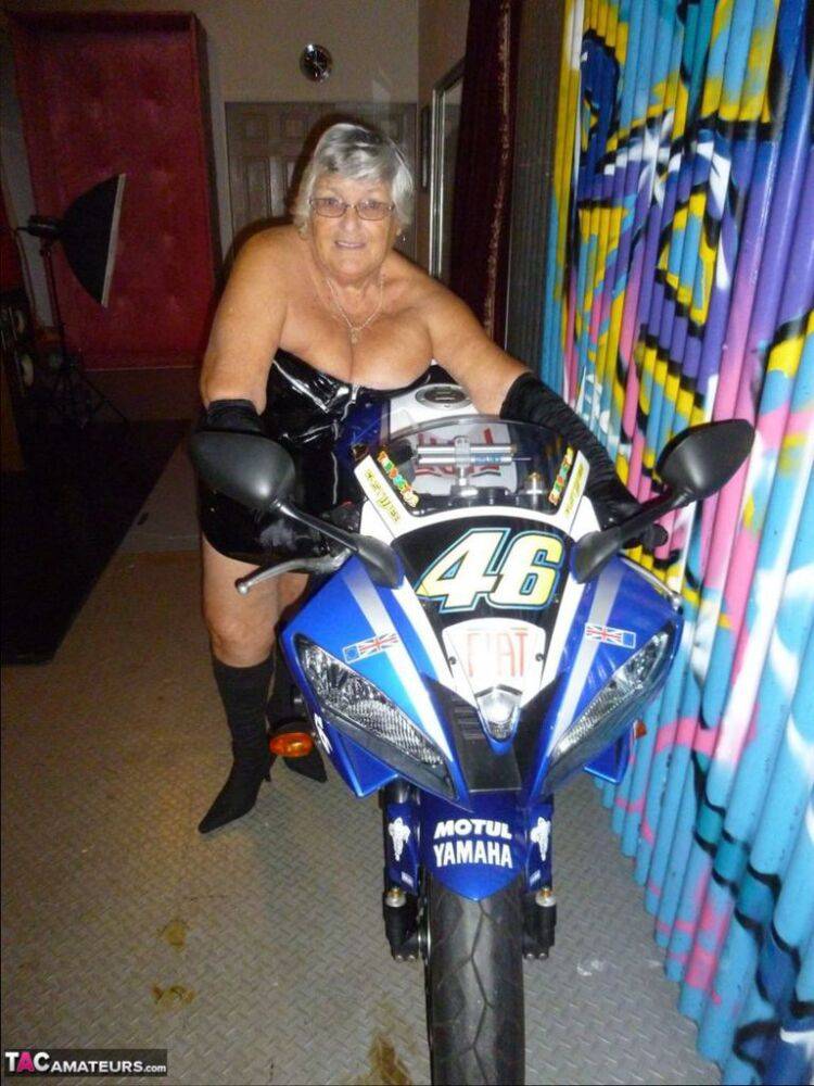 Old fatty Grandma Libby strips to black boots on top of a motorcycle - #10