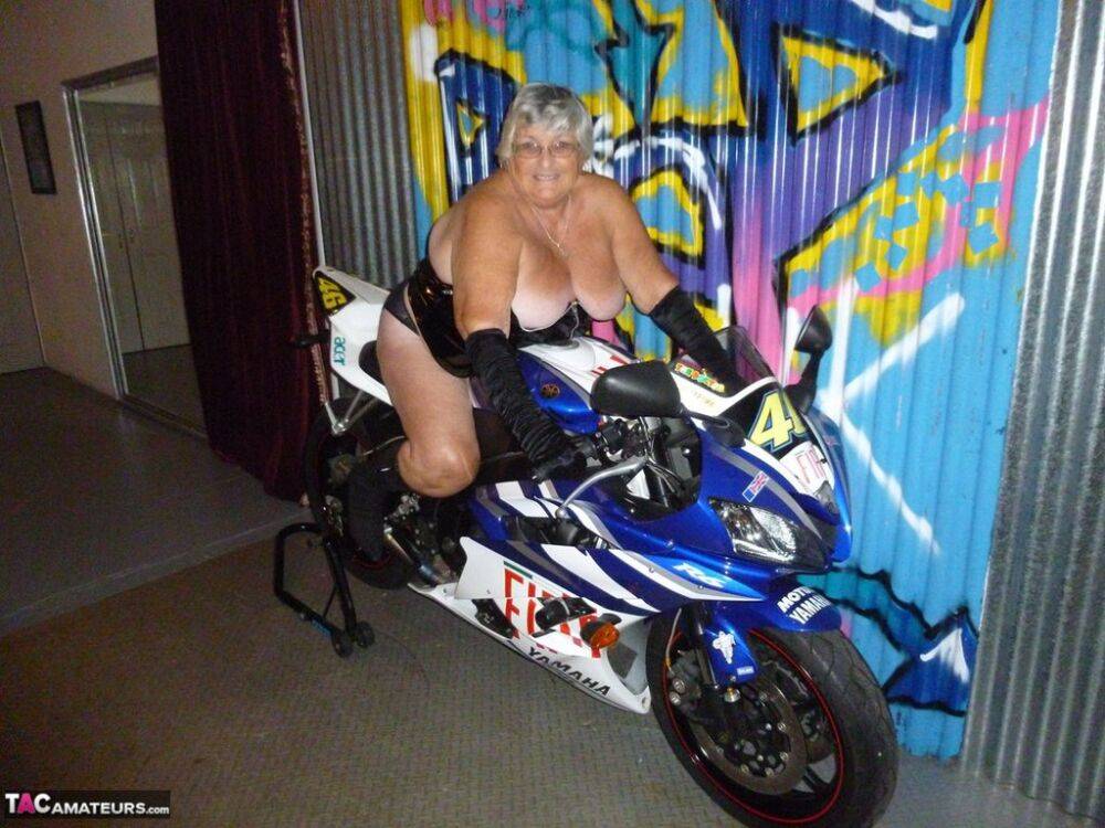 Old fatty Grandma Libby strips to black boots on top of a motorcycle - #15