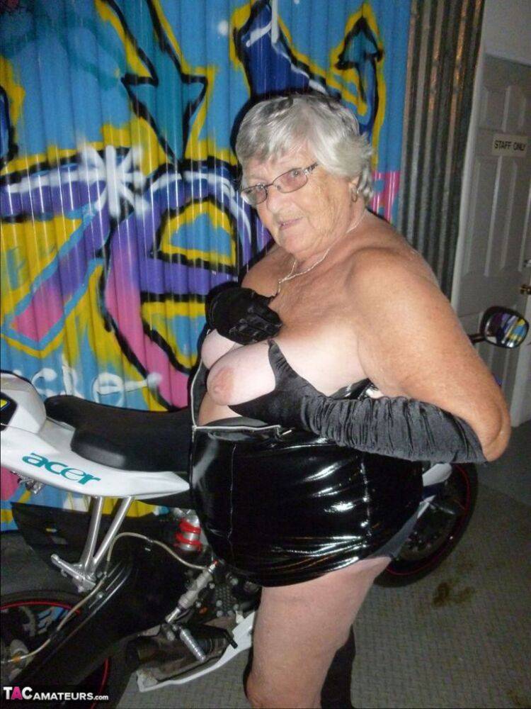 Old fatty Grandma Libby strips to black boots on top of a motorcycle - #8