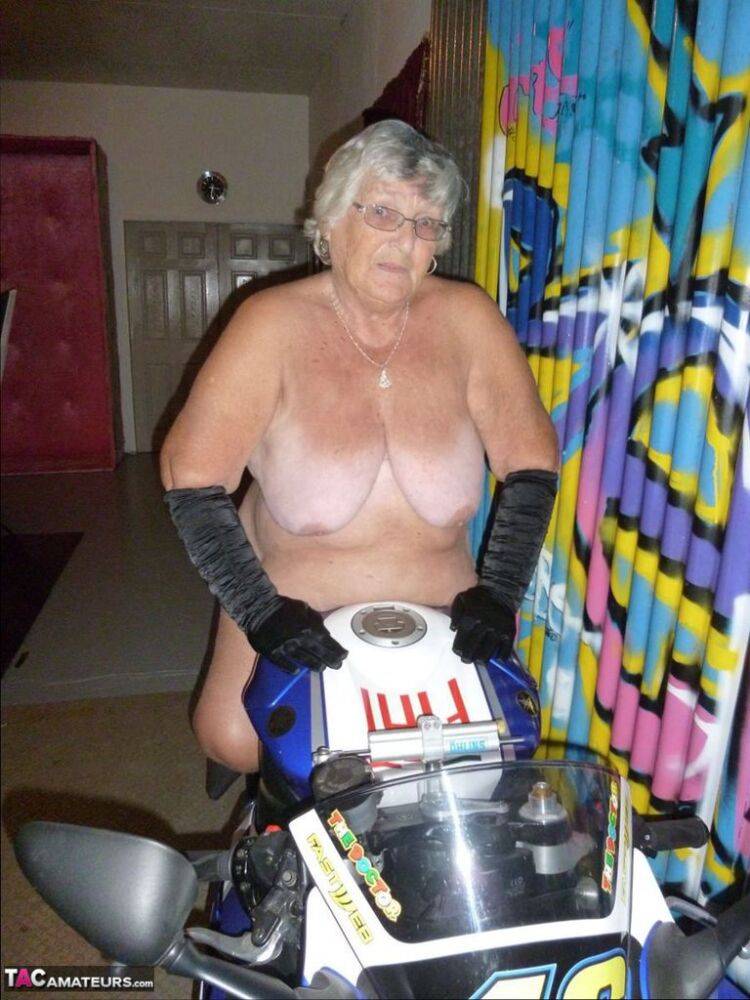 Old fatty Grandma Libby strips to black boots on top of a motorcycle - #6