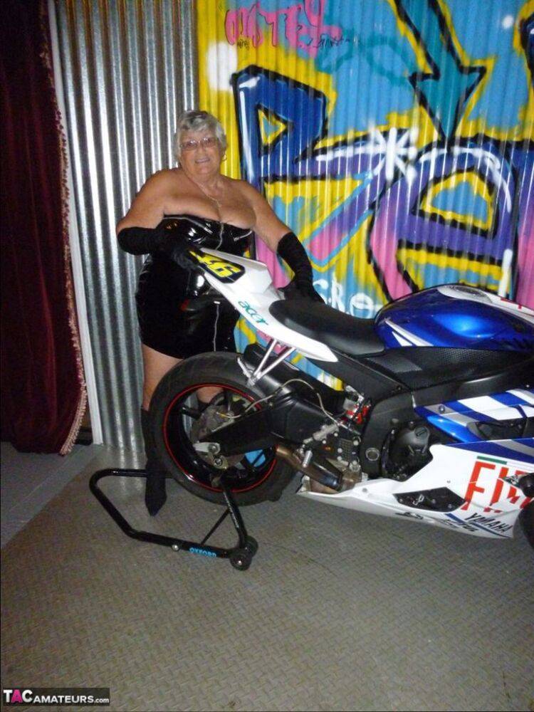 Old fatty Grandma Libby strips to black boots on top of a motorcycle - #12