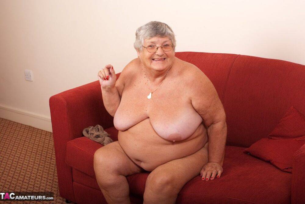 Obese nan Grandma Libby gets totally naked on a red chesterfield - #1