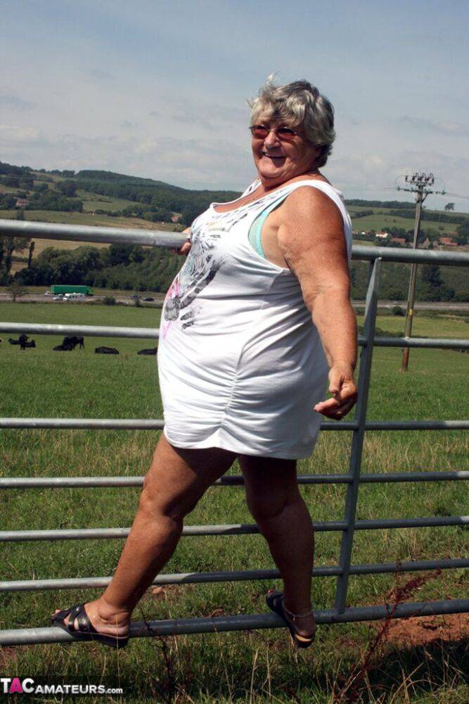 Old British woman Grandma Libby exposes herself next to a field of cattle - #4
