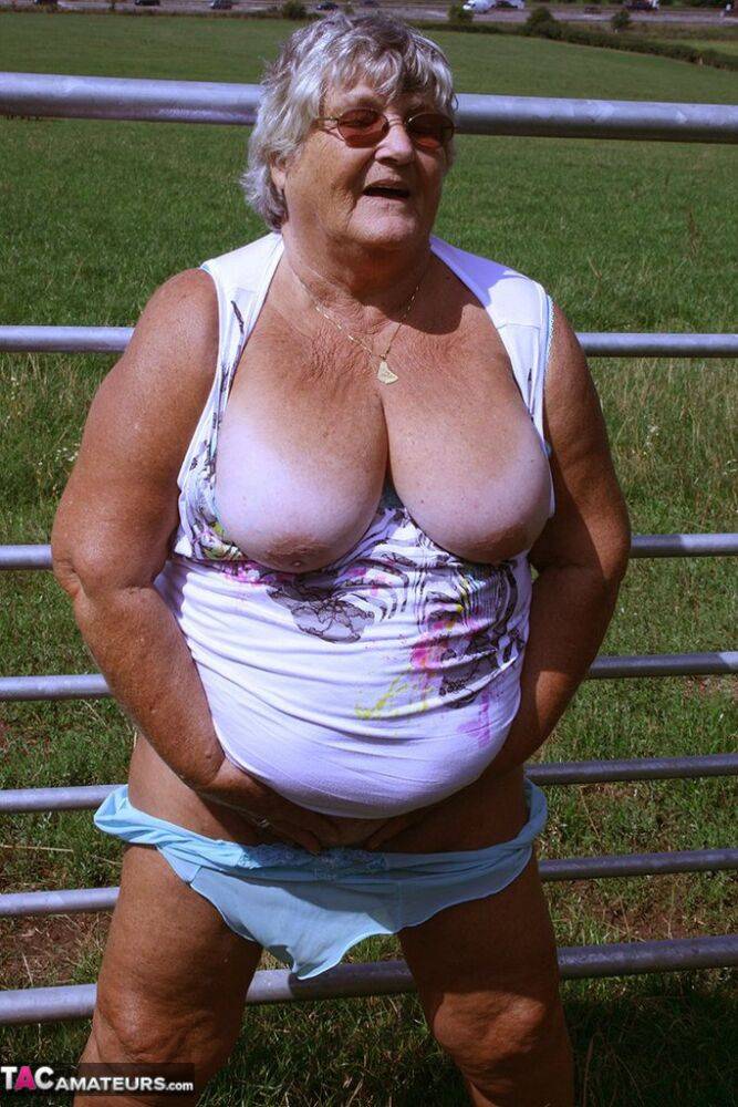 Old British woman Grandma Libby exposes herself next to a field of cattle - #11