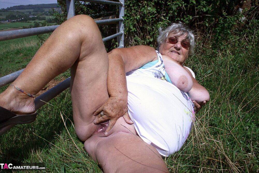 Old British woman Grandma Libby exposes herself next to a field of cattle - #7