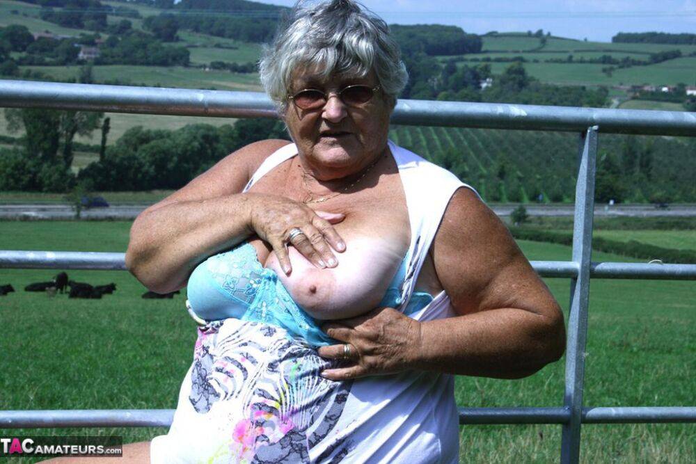 Old British woman Grandma Libby exposes herself next to a field of cattle - #13