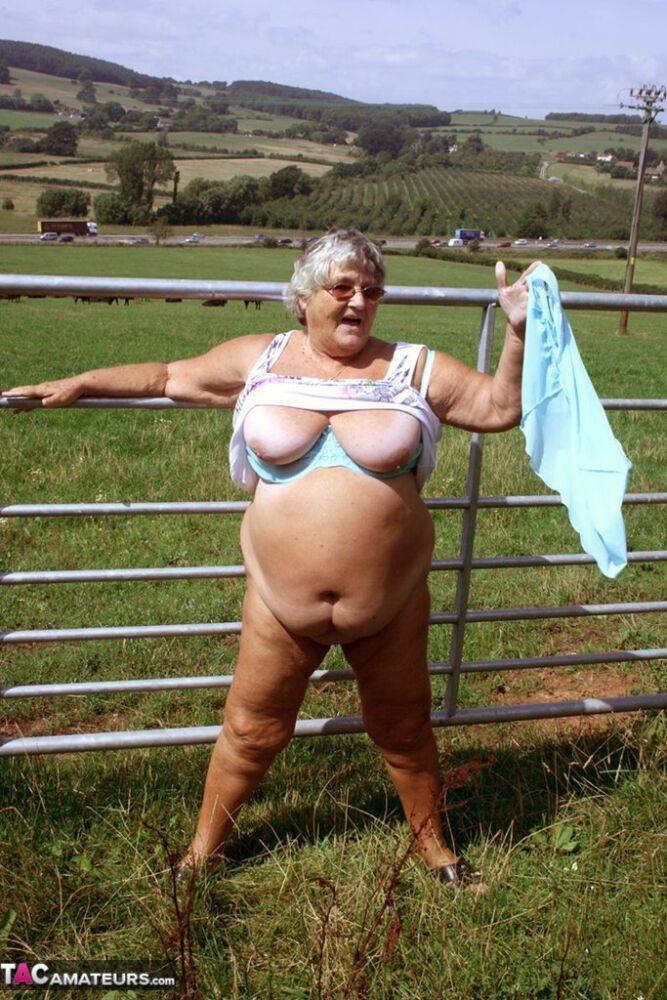 Old British woman Grandma Libby exposes herself next to a field of cattle - #10