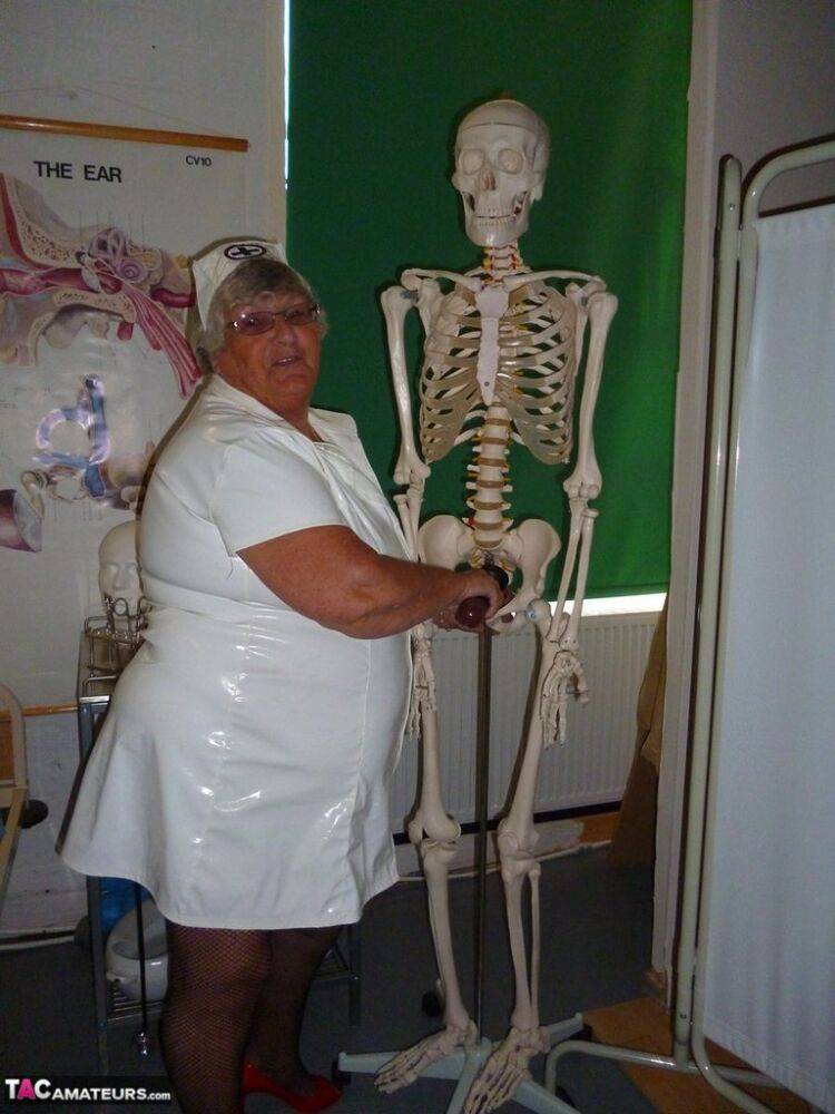 Fat old nurse Grandma Libby attaches a dildo to a skeleton for sexual relief - #14