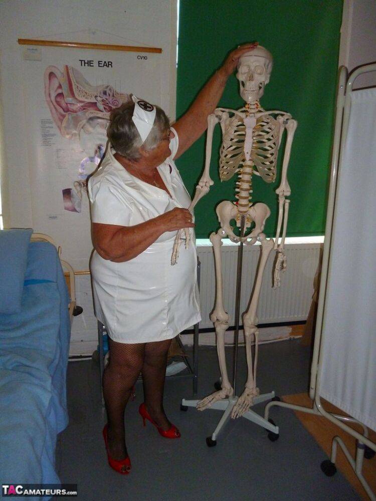 Fat old nurse Grandma Libby attaches a dildo to a skeleton for sexual relief - #2