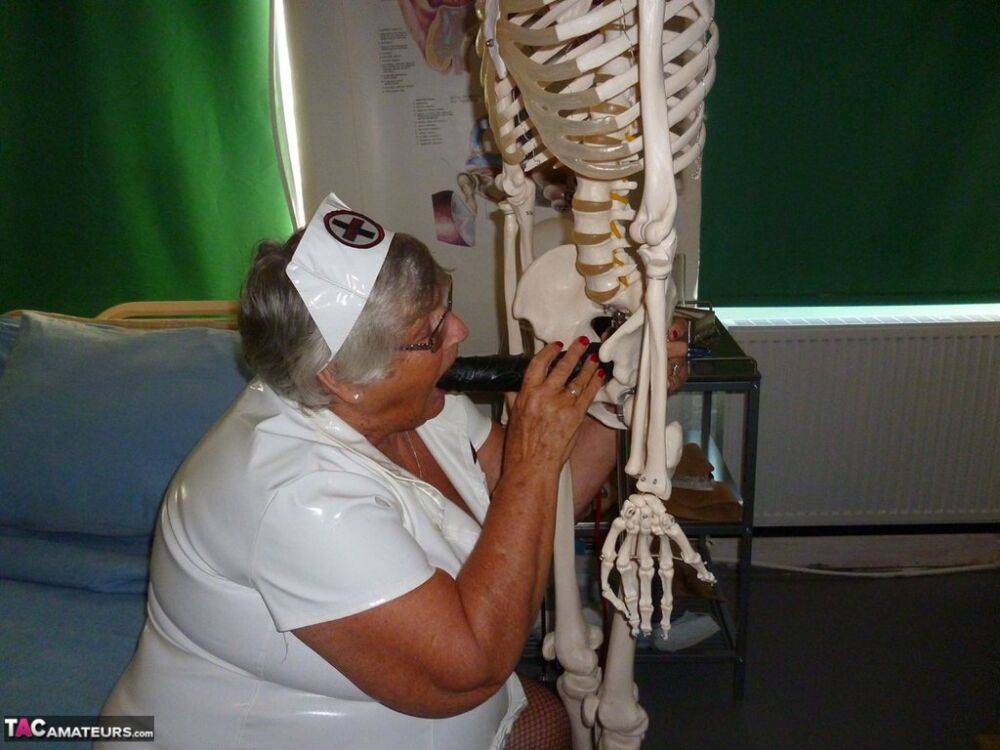 Fat old nurse Grandma Libby attaches a dildo to a skeleton for sexual relief - #8