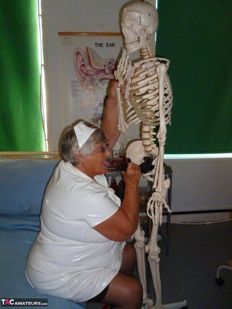 Fat old nurse Grandma Libby attaches a dildo to a skeleton for sexual relief - #16