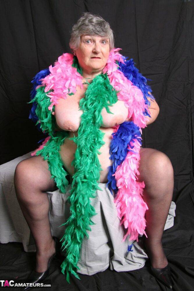Fat UK amateur Grandma Libby shows her big tits while draped in feather boas - #9