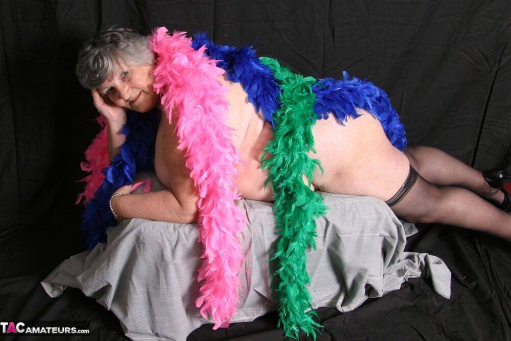 Fat UK amateur Grandma Libby shows her big tits while draped in feather boas - #11