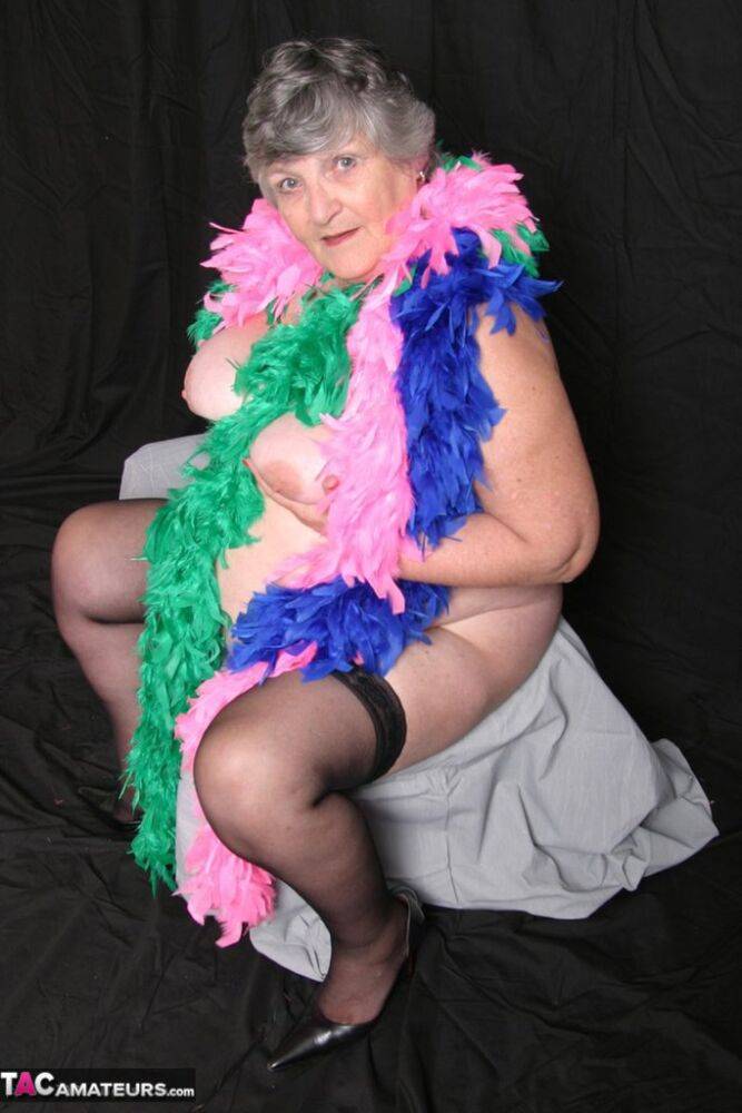 Fat UK amateur Grandma Libby shows her big tits while draped in feather boas - #10