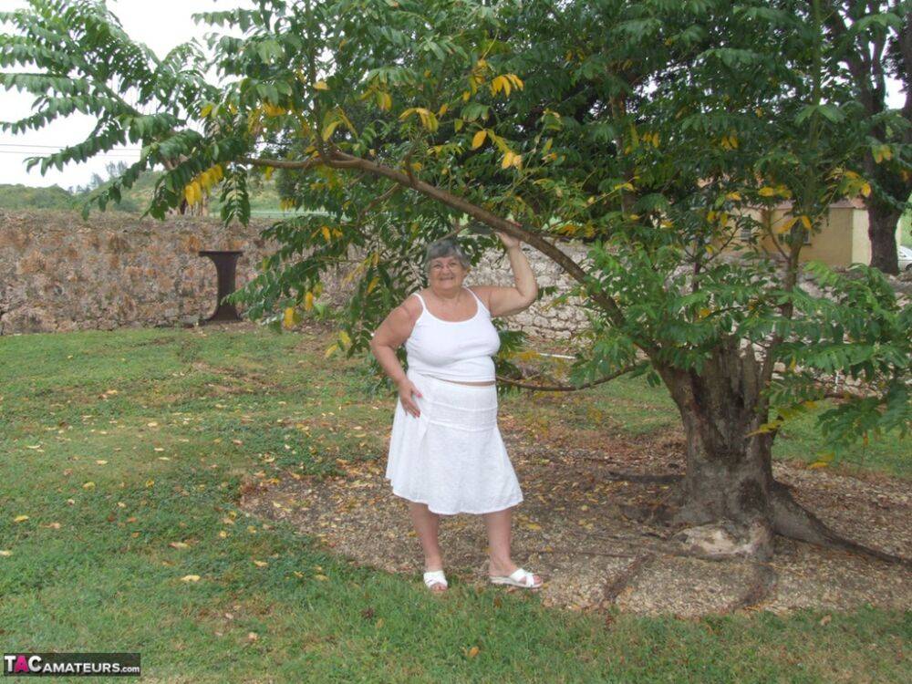 Obese British lady Grandma Libby exposes her large tits underneath a tree - #1