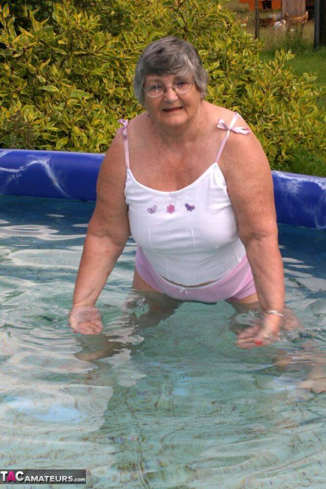 Overweight UK nan Grandma Libby exposes her boobs in a backyard swimming pool - #1