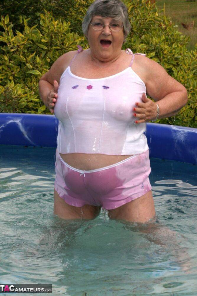 Overweight UK nan Grandma Libby exposes her boobs in a backyard swimming pool - #11