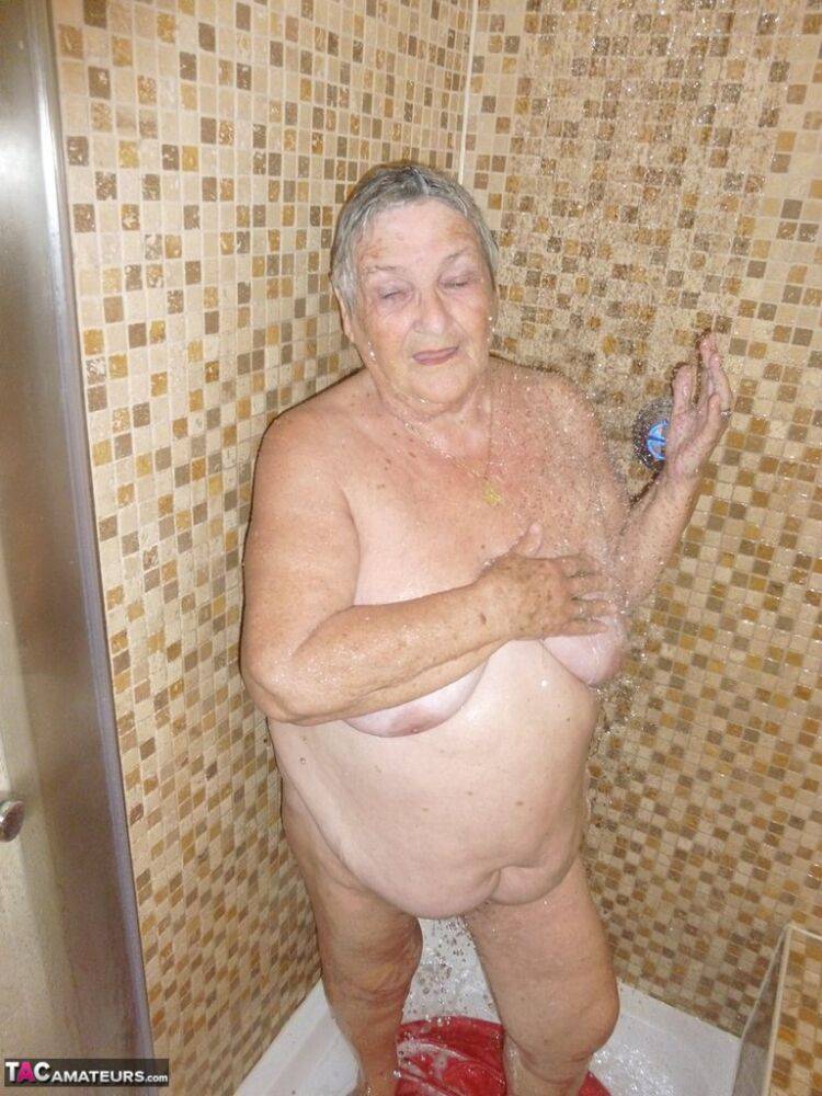 Fat old woman Grandma Libby blow dries her hair after showering - #16