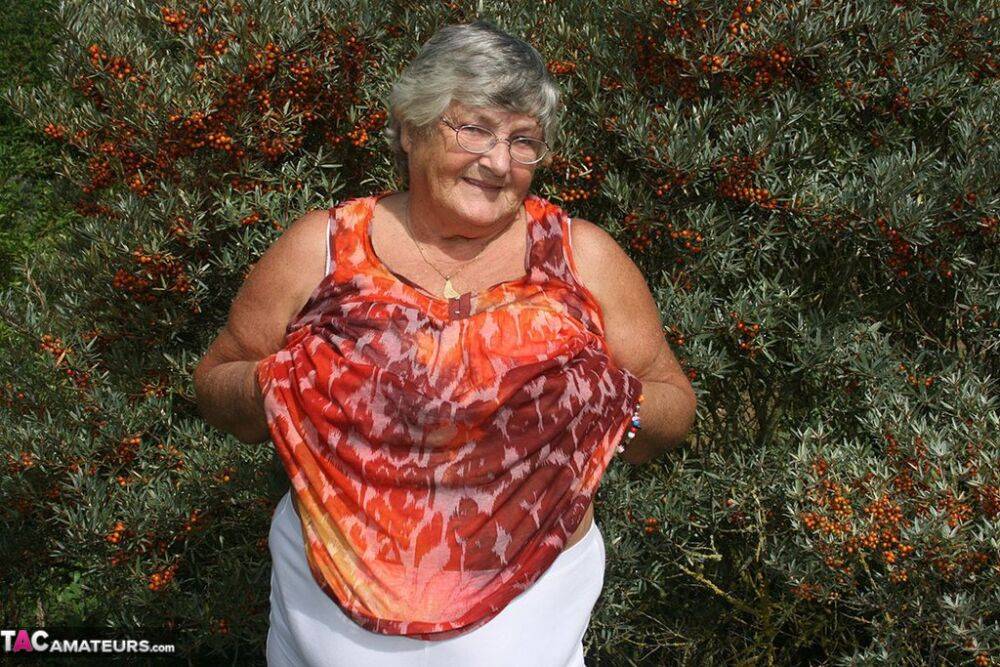 Obese nan Grandma Libby strips totally naked out by evergreen trees - #13