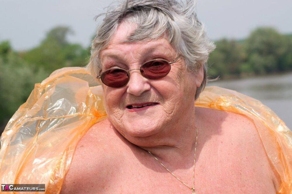 Obese oma Grandma Libby doffs a see-through raincoat to get naked on a bridge - #16
