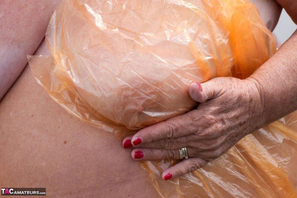Obese oma Grandma Libby doffs a see-through raincoat to get naked on a bridge - #13
