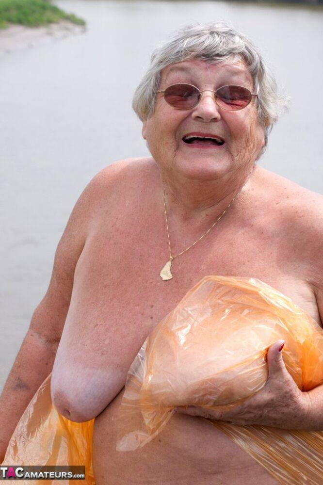 Obese British amateur Grandma Libby casts off a see-through raincoat - #16