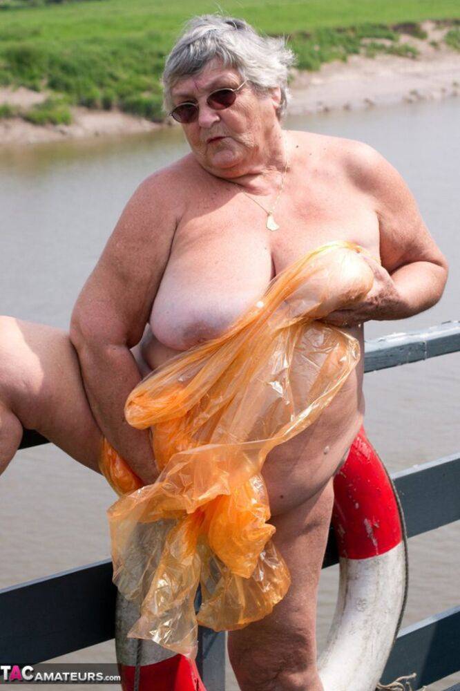 Obese British amateur Grandma Libby casts off a see-through raincoat - #1