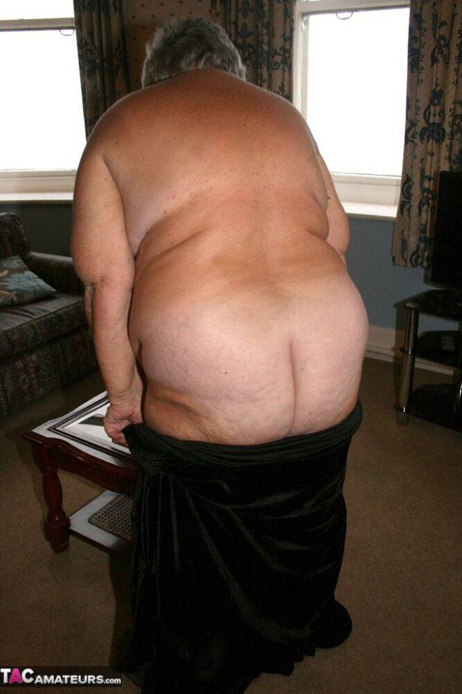 Obese UK senior citizen Grandma Libby goes naked on a loveseat in stockings - #9