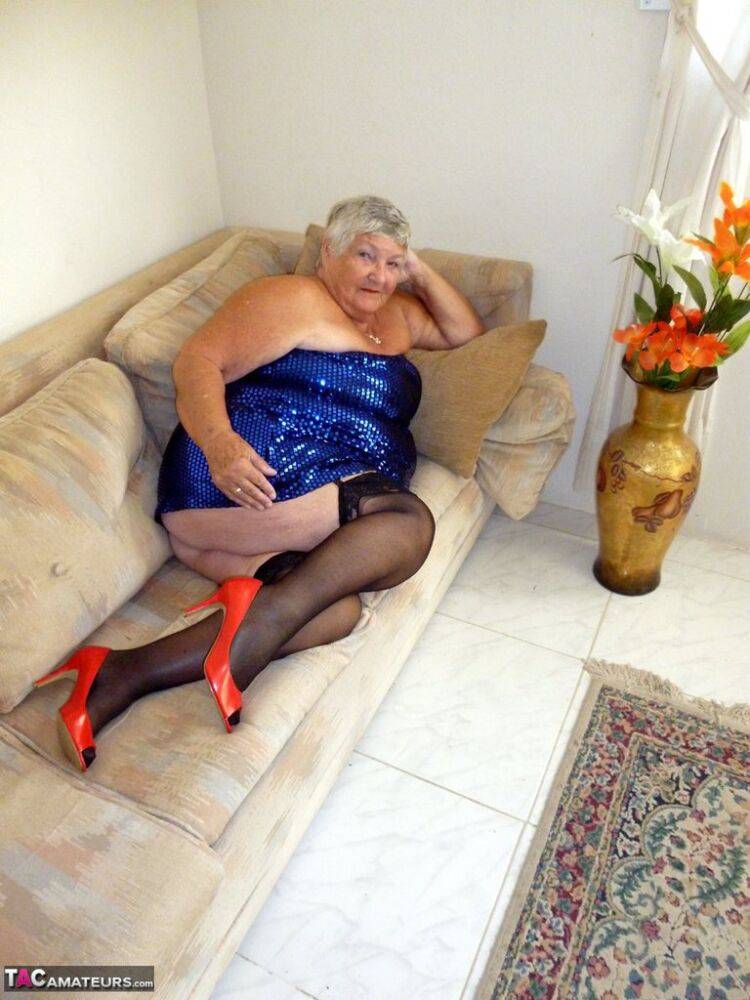 Overweight British woman Grandma Libby plays with herself on a sofa in nylons - #13