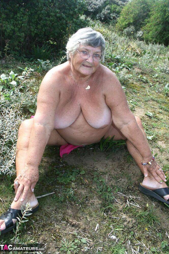 Fat British woman Grandma Libby gets naked on a towel upon scrubby ground - #15