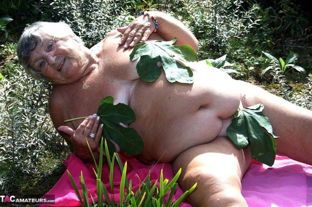 Fat British woman Grandma Libby gets naked on a towel upon scrubby ground - #11