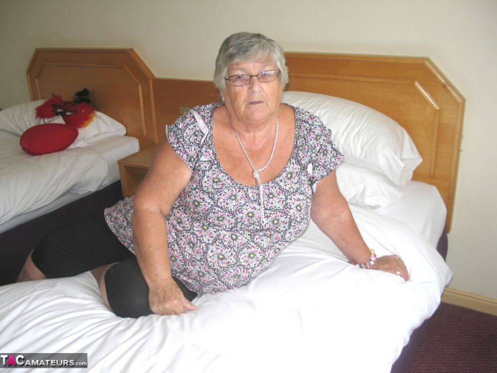 Silver haired British woman Grandma Libby exposes her fat body on a bed - #10