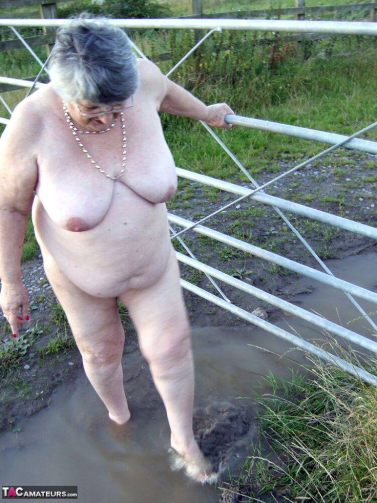 Fat nan Grandma Libby steps into a puddle before covering herself in mud - #12