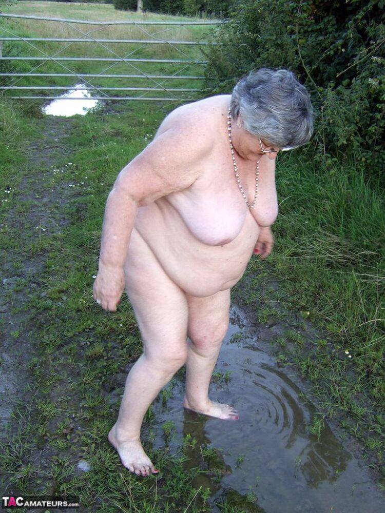 Fat nan Grandma Libby steps into a puddle before covering herself in mud - #9