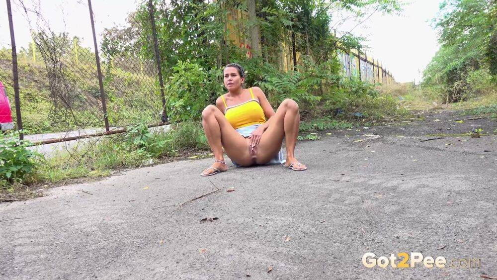 Short taken girl Chloe Lamour takes a badly needed piss on a patch of pavement - #12