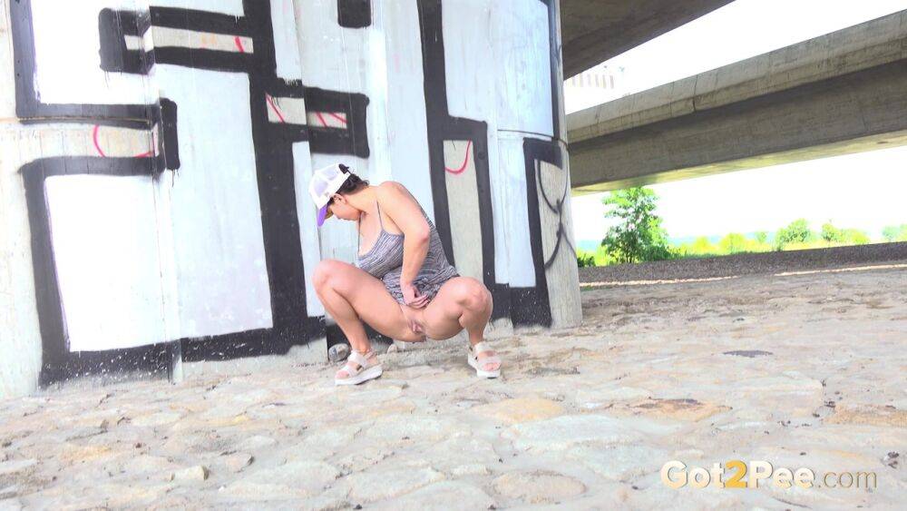 Chloe Lamour squats near a bridge to piss - #5