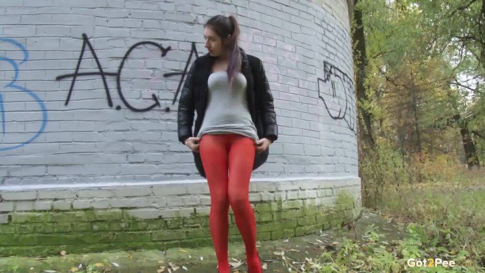 Pretty brunette pulls down pantyhose to pee - #4