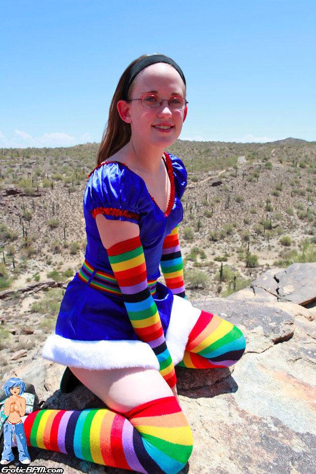 White teen Bunny strips to multi-colored arm and legs socks on an outcrop - #14