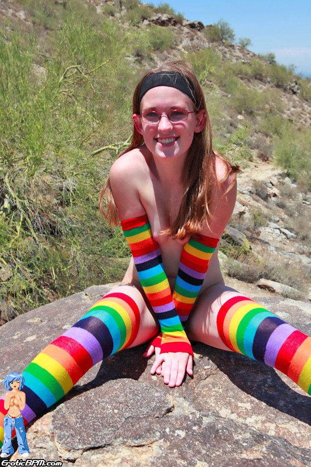 White teen Bunny strips to multi-colored arm and legs socks on an outcrop - #10