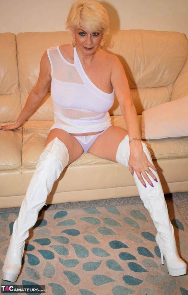 Older blonde pulls down a white thong in over the knee latex boots - #15