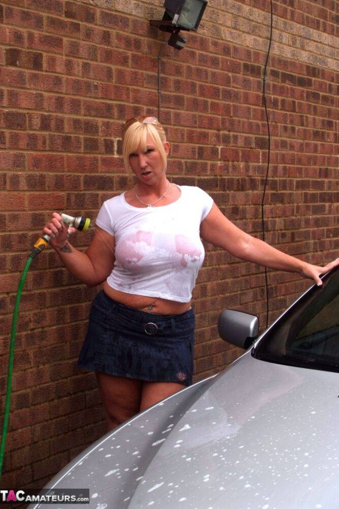 Big titted blonde amateur Melody soaks a white T-shirt while washing her car - #4