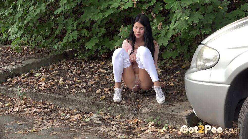 Dark haired girl Dee pulls down her white leggings for quick pee behind bushes - #10