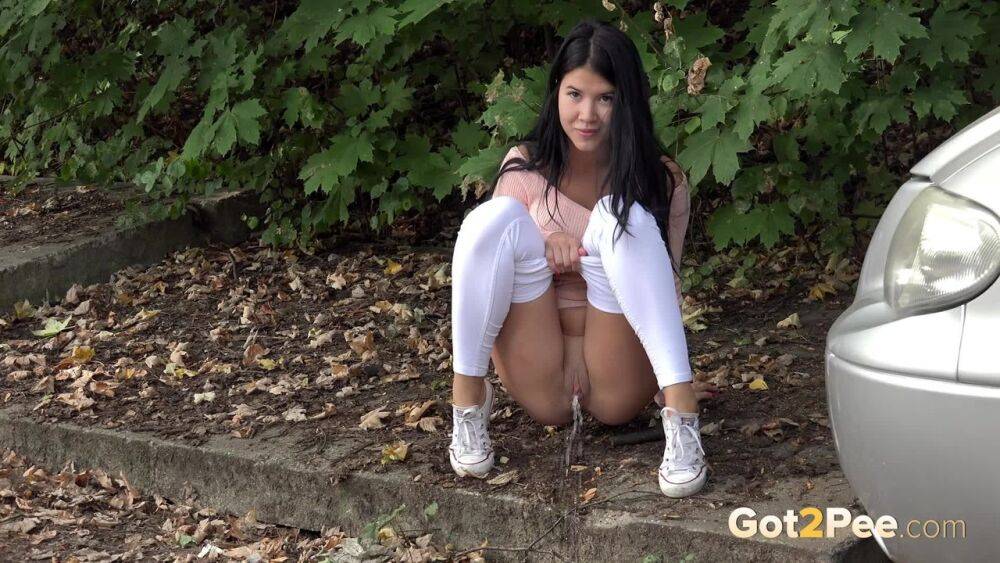 Dark haired girl Dee pulls down her white leggings for quick pee behind bushes - #7