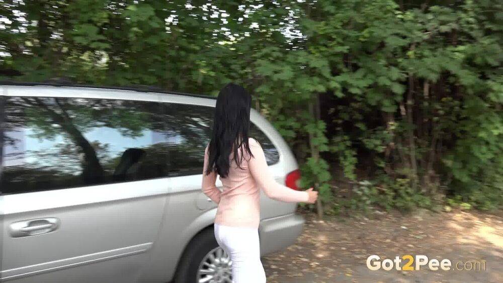 Dark haired girl Dee pulls down her white leggings for quick pee behind bushes - #14